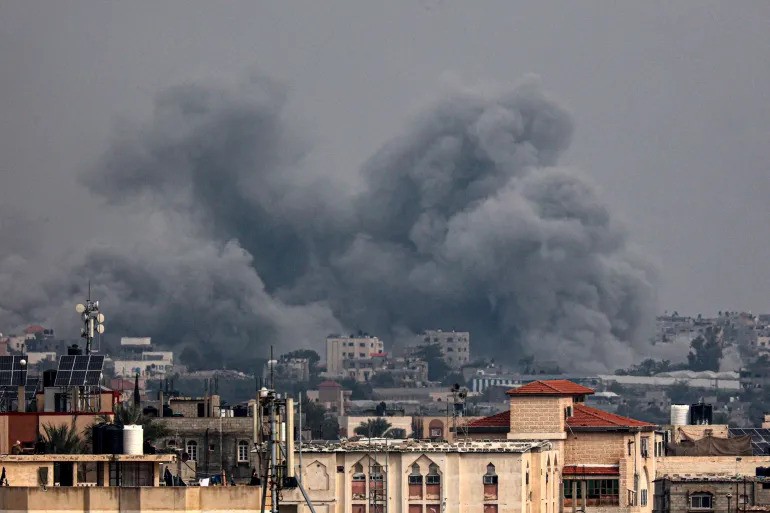 Smoke billowing over Khan Younis during an Israeli bombardment on January 17, 2024 [AFP]
